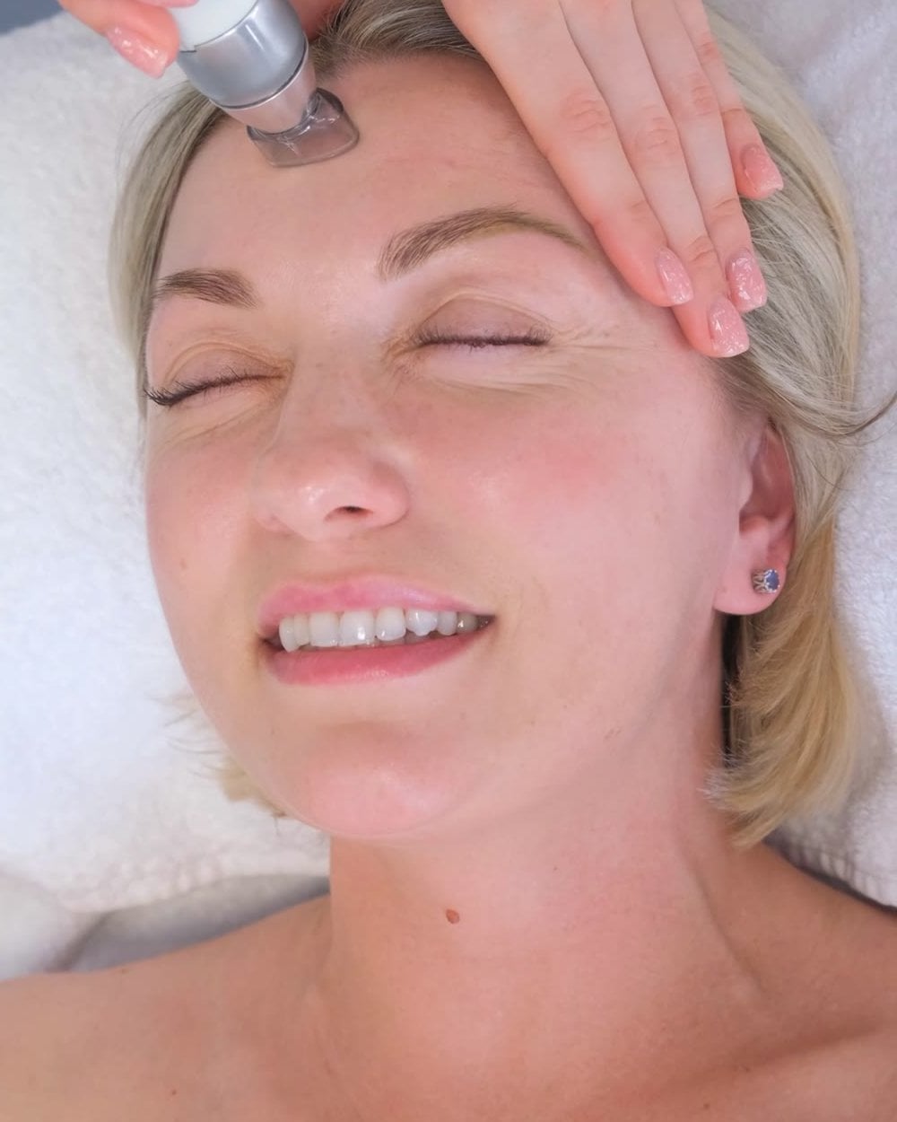 Smiling client during a facial